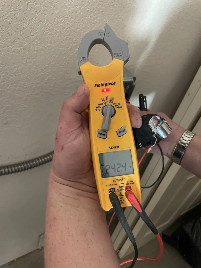 Voltage testing with clamp meter during Aluminum Wiring Replacement in Riva